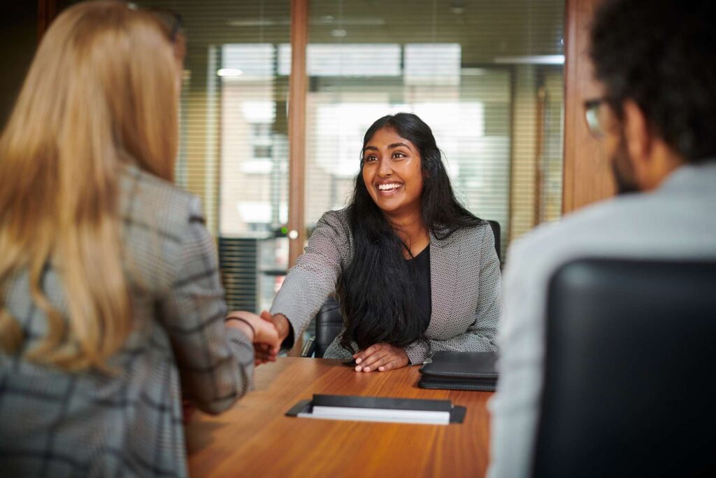 How to Follow Up After a Job Application or Interview: Young Female Professional at a Job Interview.