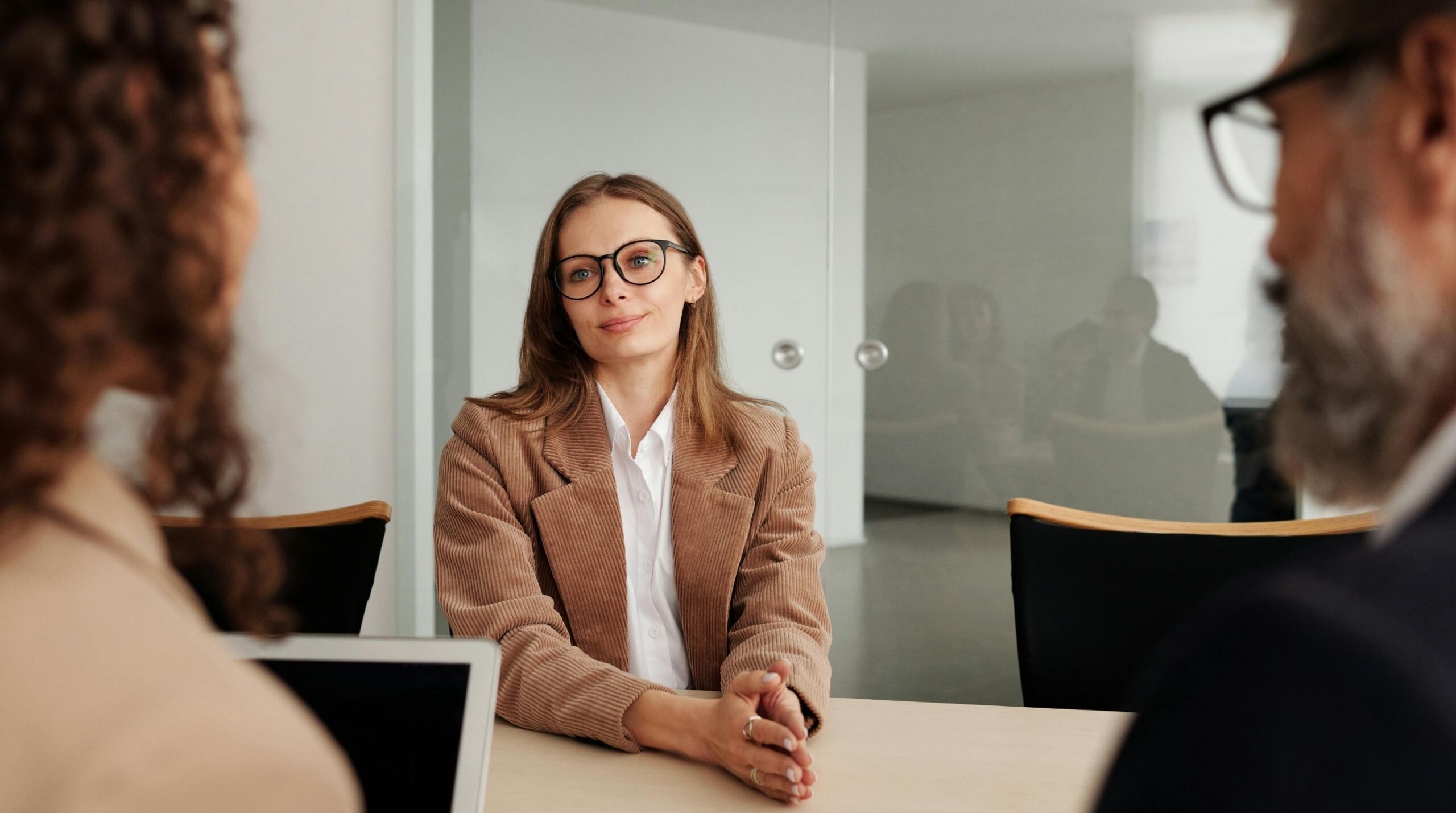 HR professionals in a meeting discussing hiring and recruitment strategy and talent acquisition strategy